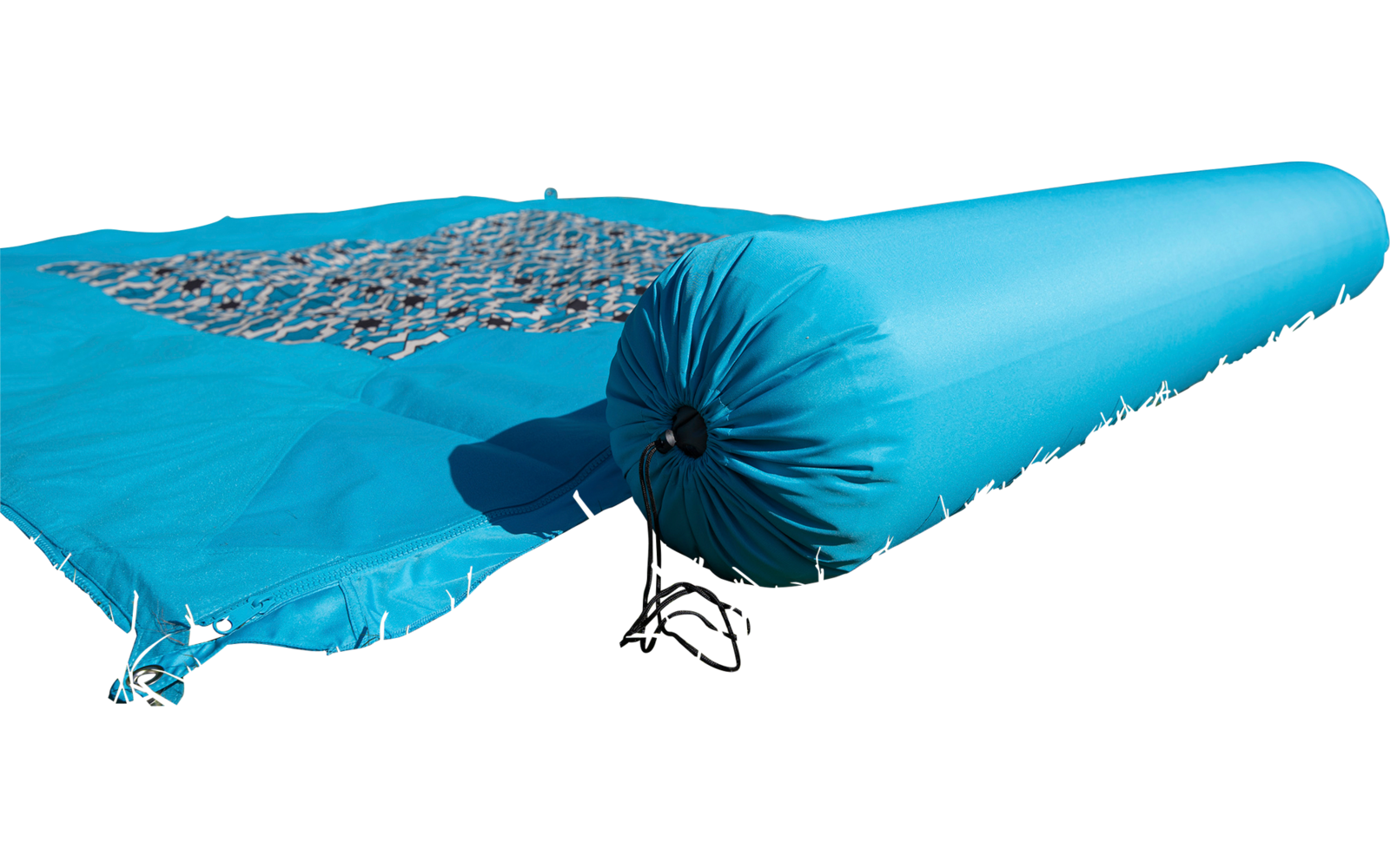 Blue rolled-up fabric piece with net on green grass