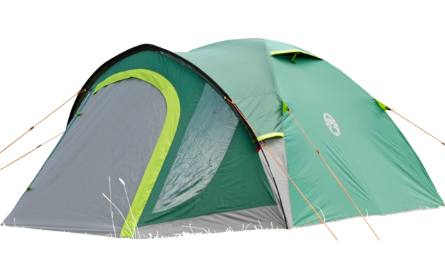 Green tent standing on a grassy field with trees in the background