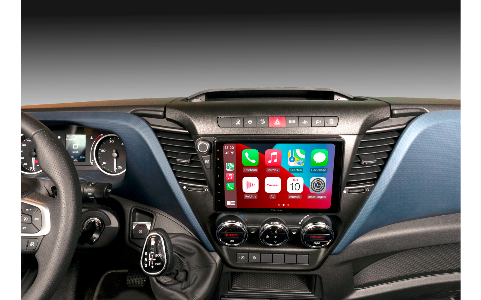 View of a car dashboard and steering wheel with touchscreen and control buttons