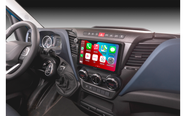 Interior of a vehicle with steering wheel and digital display in the center