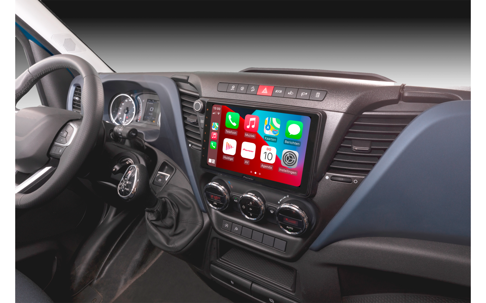 Interior of a vehicle with steering wheel and digital display in the center