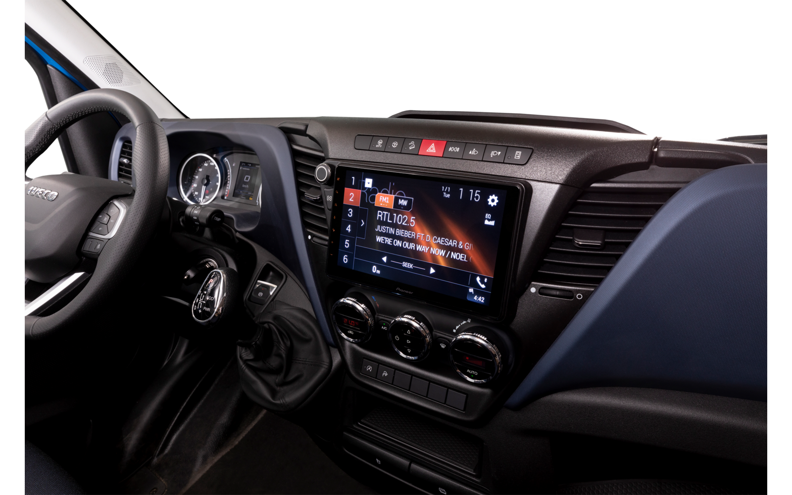 Car interior with steering wheel and digital display on the center console