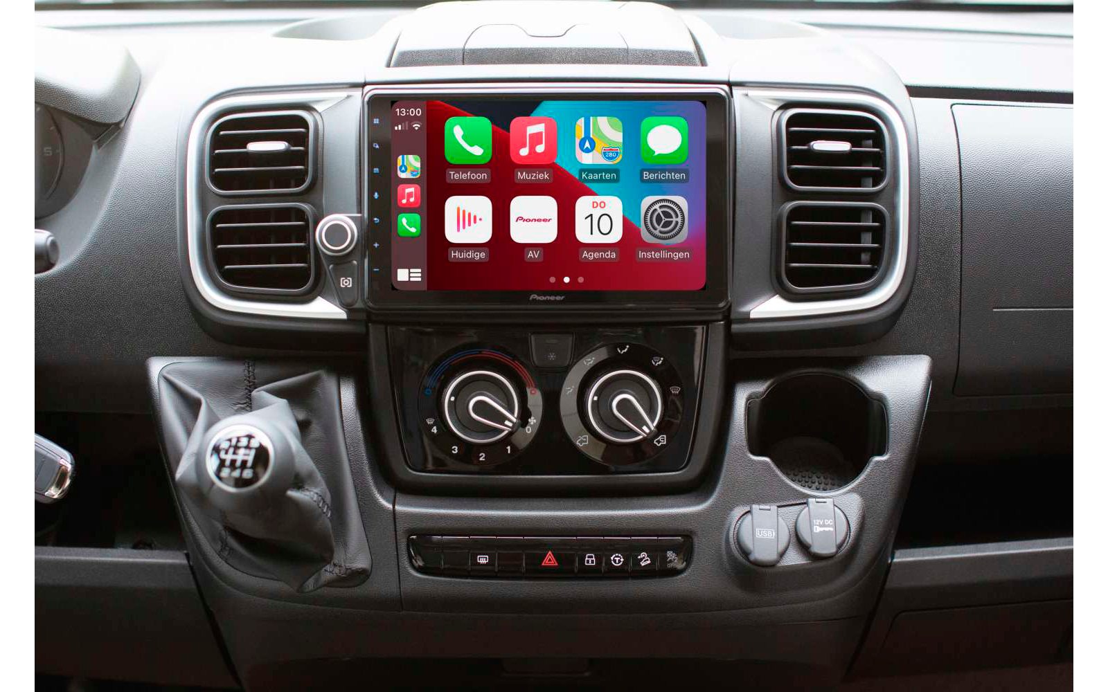 Dashboard of a vehicle with a multifunction display and control buttons