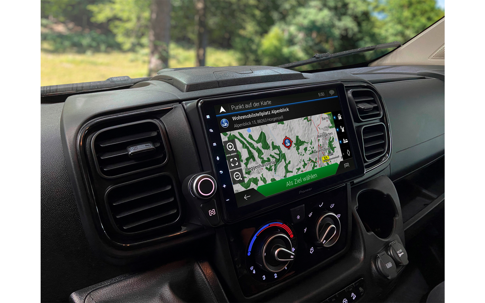 View of a vehicle dashboard with an integrated navigation device and climate control