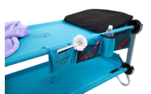 Blue camping chair with side pocket, water bottle, and flower