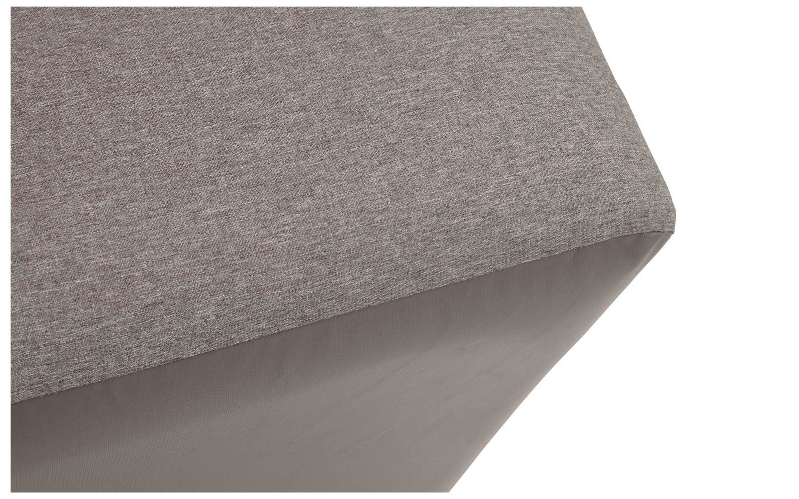 Corner of a piece of furniture with grey fabric cover