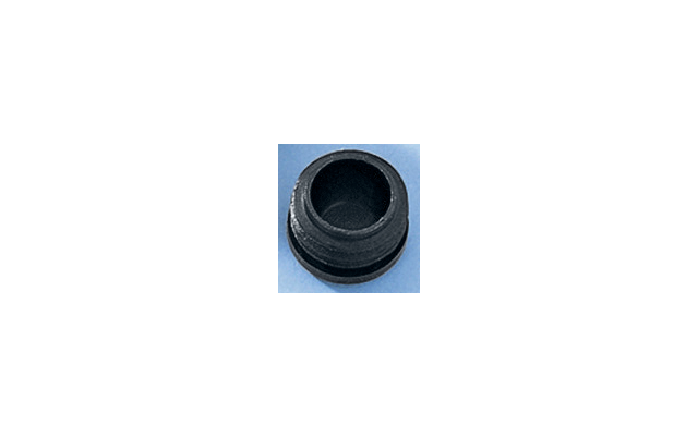 Un piccolo oggetto rotondo nero su sfondo bianco