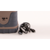 Brown and gray hiking shoe next to a black charging cable on a white background