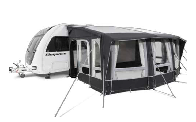 Weißer Wohnwagen mit schwarzem und grauem Vorzelt