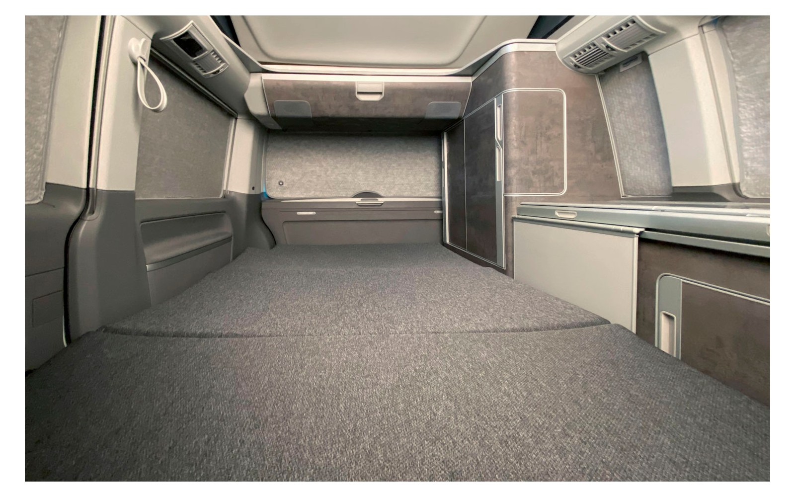 Interior of an empty truck cabin with seat and storage space