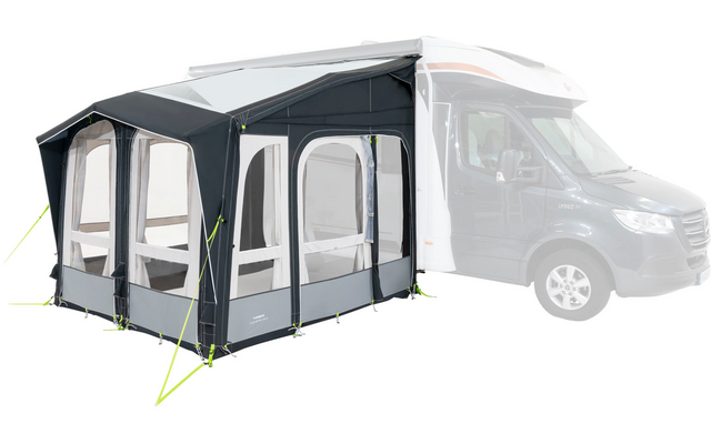 A white motorhome with a gray attached awning