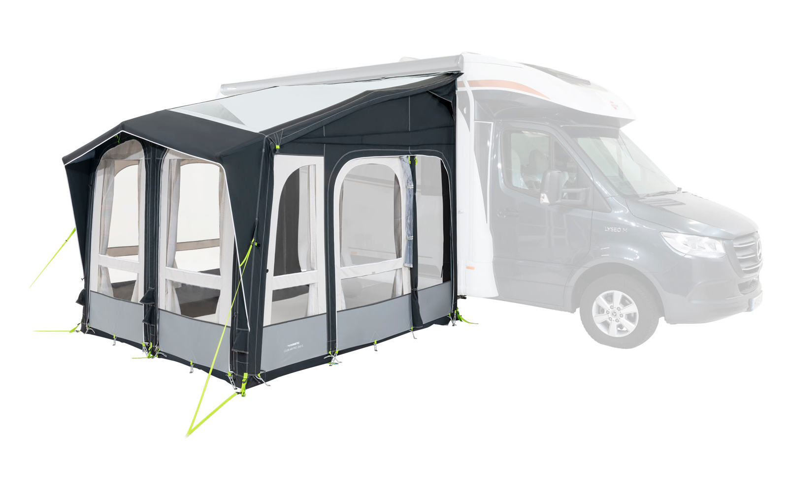 A white motorhome with a gray attached awning