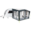 A white caravan with an attached gray awning and windows