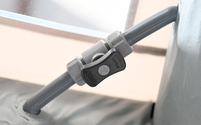 Close-up of a gray vacuum cleaner tube with a joint