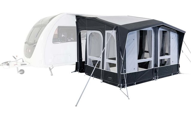 Grande tenda da campeggio nera e grigia con vestibolo bianco su erba verde