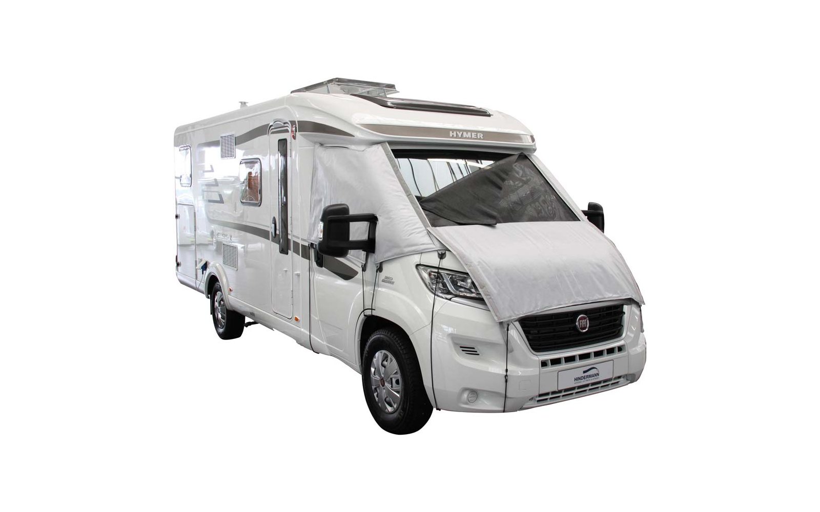 Camper bianco visto di lato con tenda da sole estesa