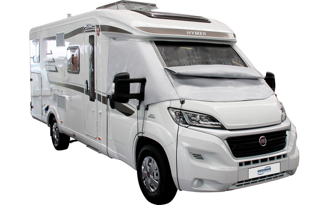 Camper bianco visto di lato con porta chiusa e cabina di guida visibile