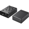 Two black rectangular objects with holes, one flat, one raised