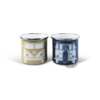 Two coffee cups, one light with pattern, one dark blue with pattern, side by side on white background