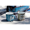 Two enamel mugs in blue and gray in front of a model Volkswagen bus