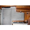 Interior of a motorhome with wooden cabinets and kitchen area