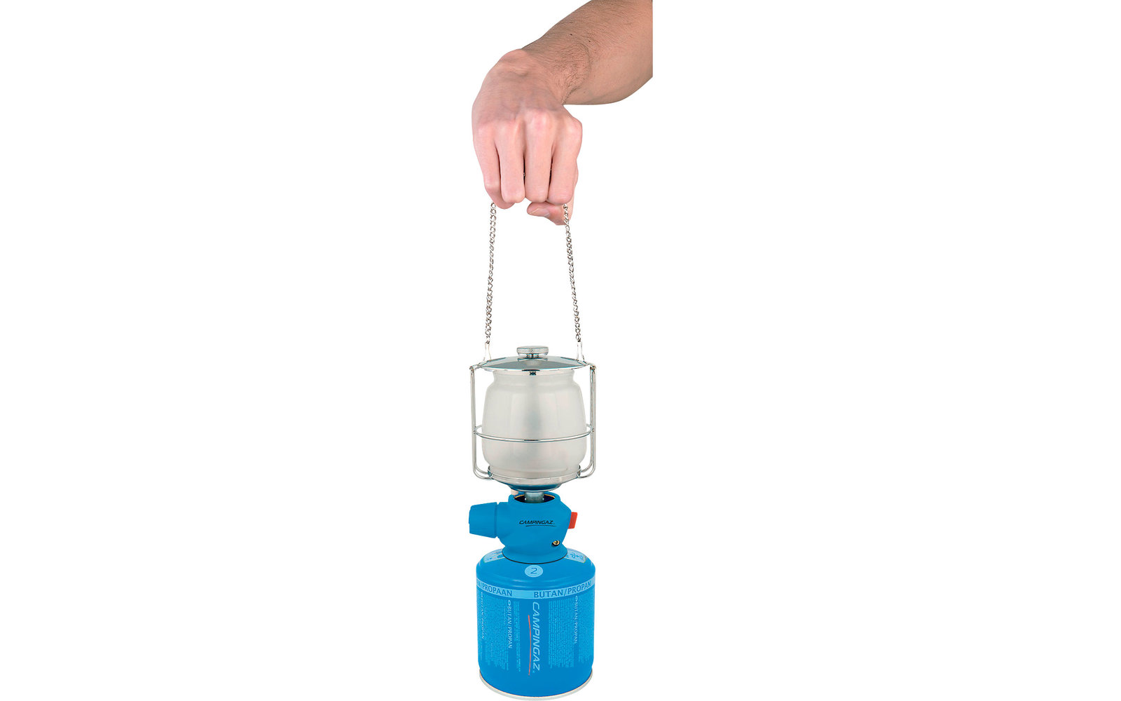 Hand holding lantern above blue camping stove
