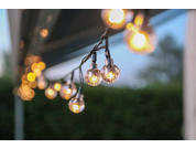 Close-up of hanging light bulbs with a blurred background