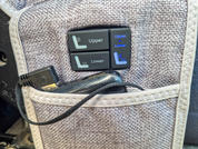 Grau-beige Stofftasche mit schwarzem Bedienfeld (zwei Tasten beschriftet 'Upper' und 'Lower') und schwarzem Kabel mit Stecker