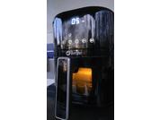 Black device with digital display '05', brand name 'Berger', viewing window showing orange interior light, and long black handle with silver edge