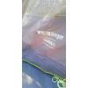 Tessuto di tenda con logo stampato "Berger" e scritta "TOURING-L", cordoncino verde e orlo verde visibili