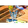 Glass of water and cutlery on a wooden table in sunlight