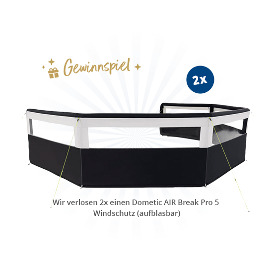 Schwarzer sechseckiger Windschutz mit weißem oberen Rand und grünen Spannleinen, blauer Strahlenhintergrund, goldener Schrift 'Gewinnspiel', weißer '2x'-Text und kleine weiße Beschriftung unten 'Wir verlosen 2x einen Dometic AIR Break Pro 5 Windschut